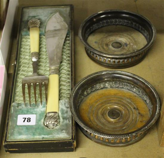 Pair of plated lune coasters, cased pair of fish servers and a cased set of 6 ivory mounted plated napkin rings